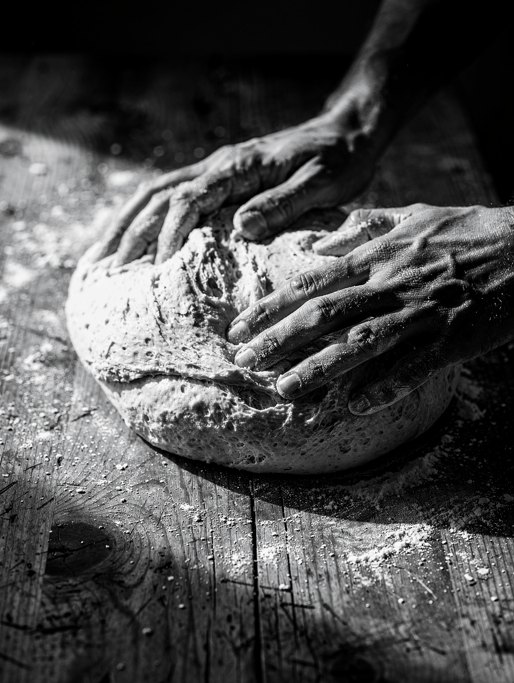 Bakery craft in Ghent kneading sourdough with flour dust